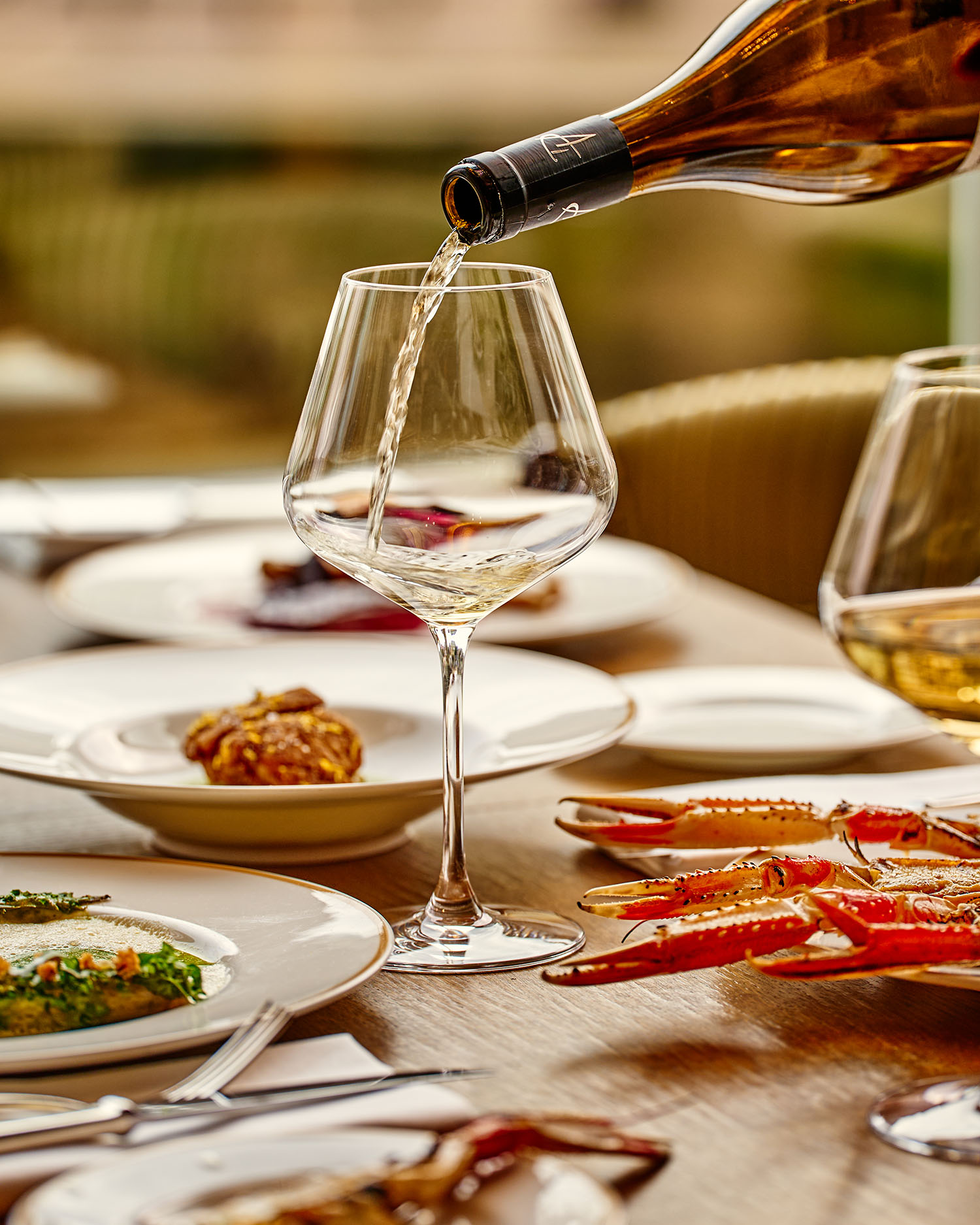 Brassier Marie Table with a selection of dishes and wine.